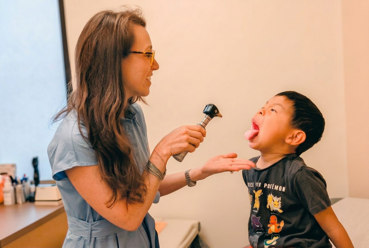 Pediatrician examining a young child
